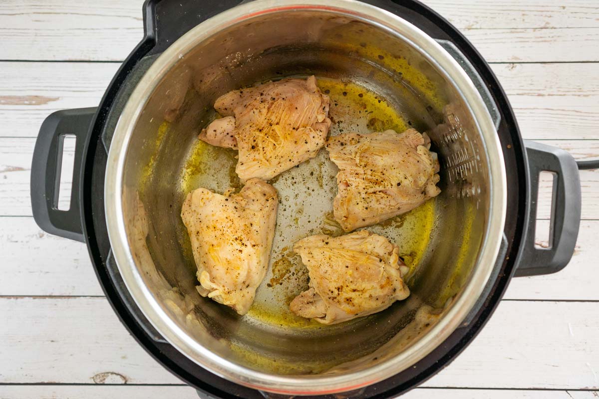Browned chicken thighs in an Instant Pot