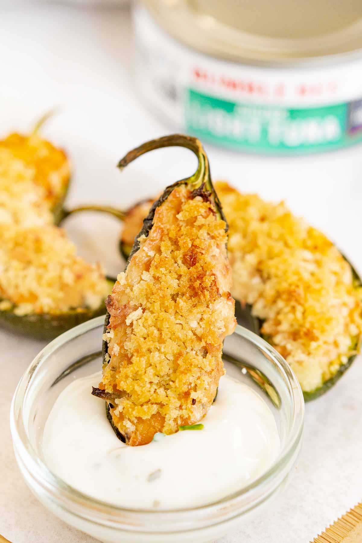 Tuna jalapeño popper dipped into Ranch dressing.