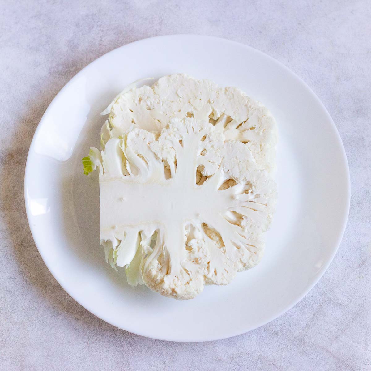 Cauliflower sliced into a steak shape