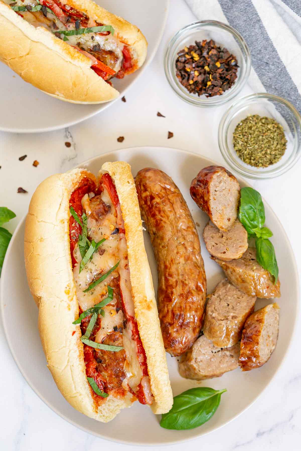 Plate of air fried Italian sausages and Italian sausage sandwich