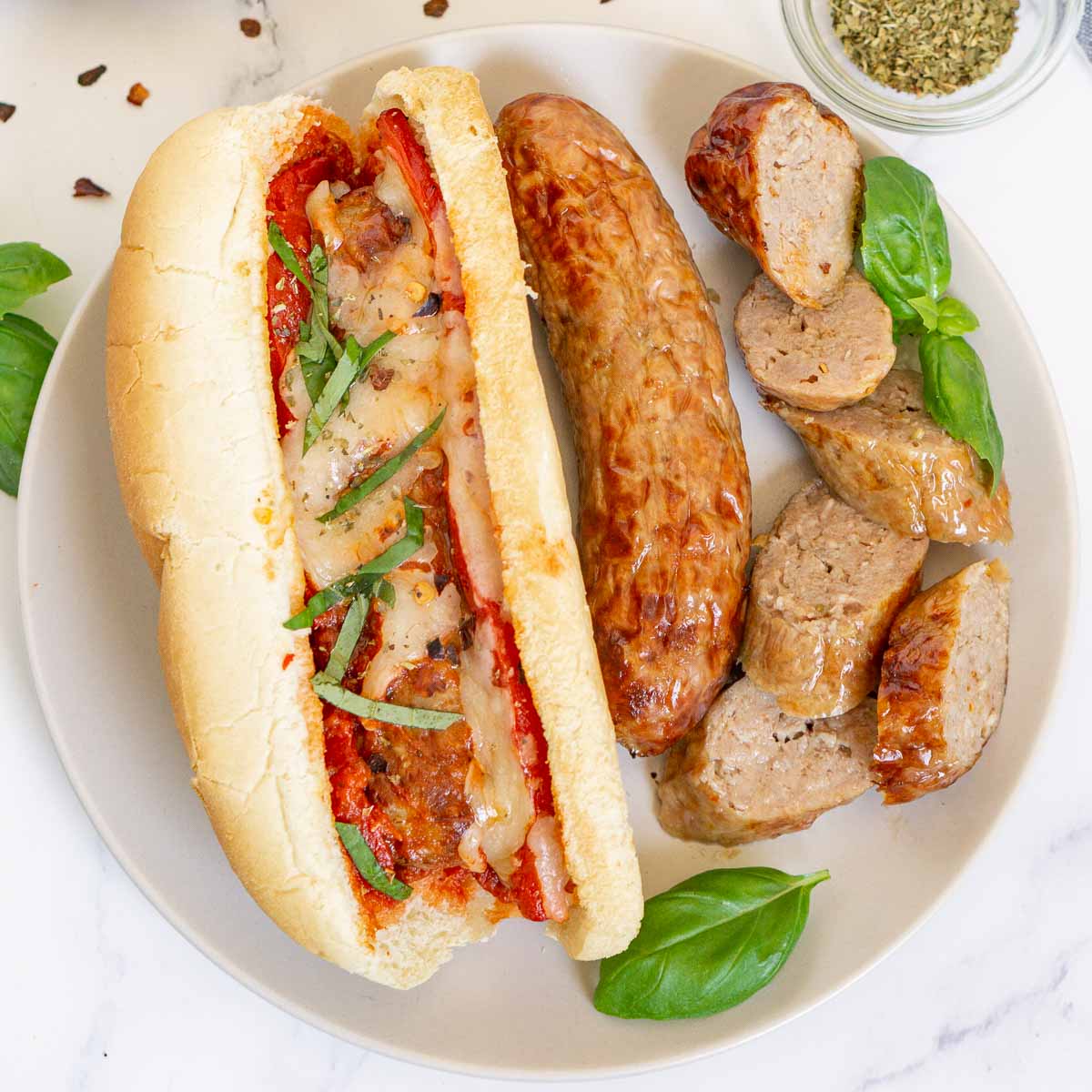 Plate of air fried Italian sausages and Italian sausage sub