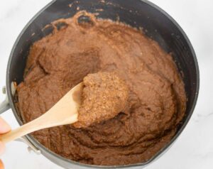 Cooked chocolate cream of wheat in a saucepan to show texture