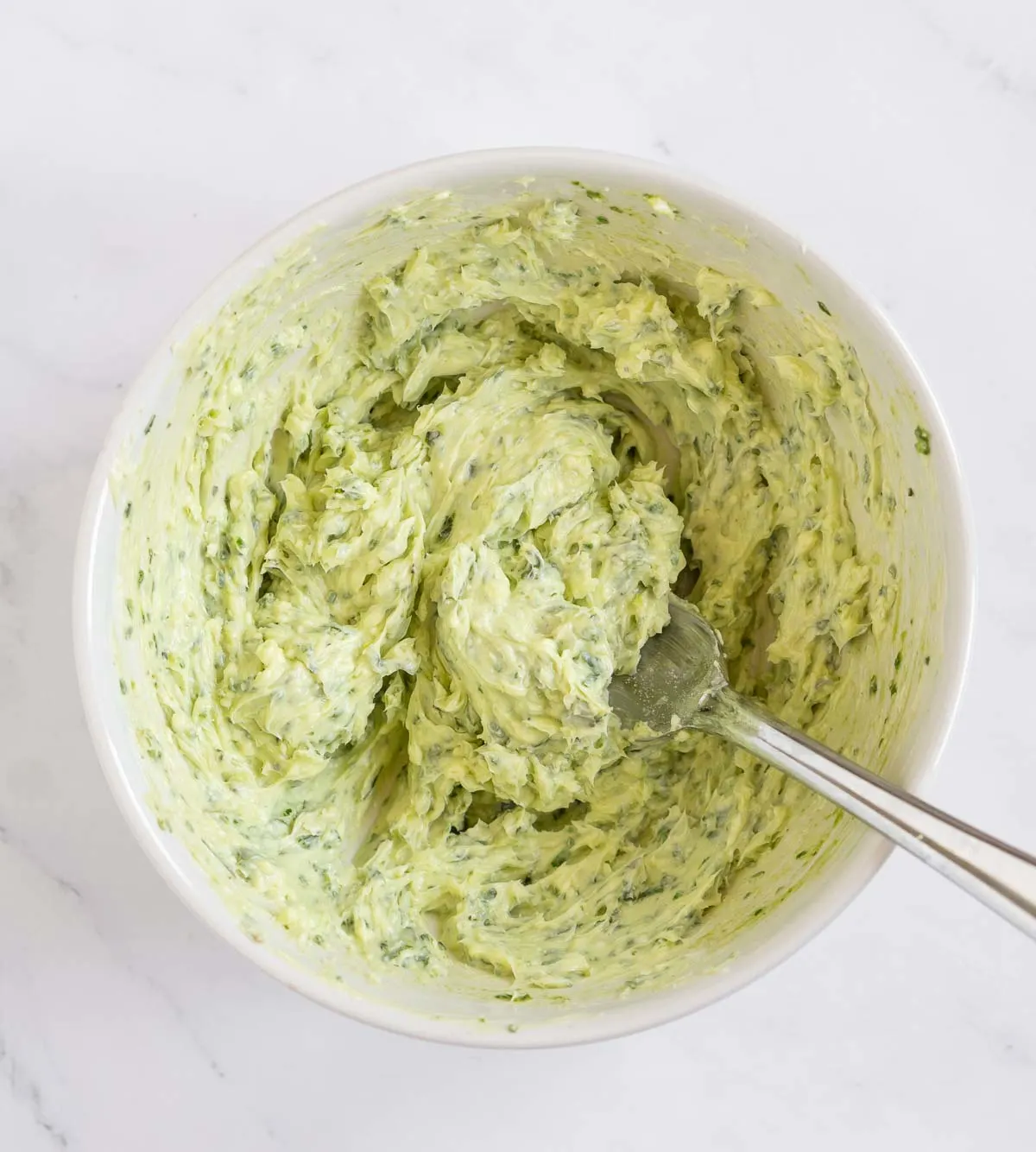 Pesto butter mixed in a bowl