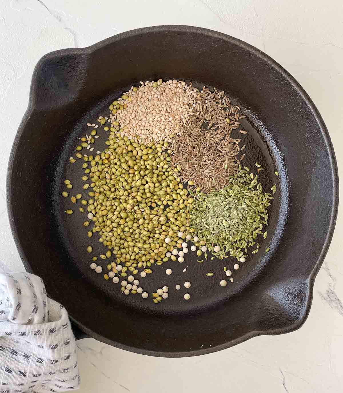 Dukkah seasonings toasting in a pan