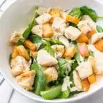 Spinach Caesar salad with diced air fryer chicken