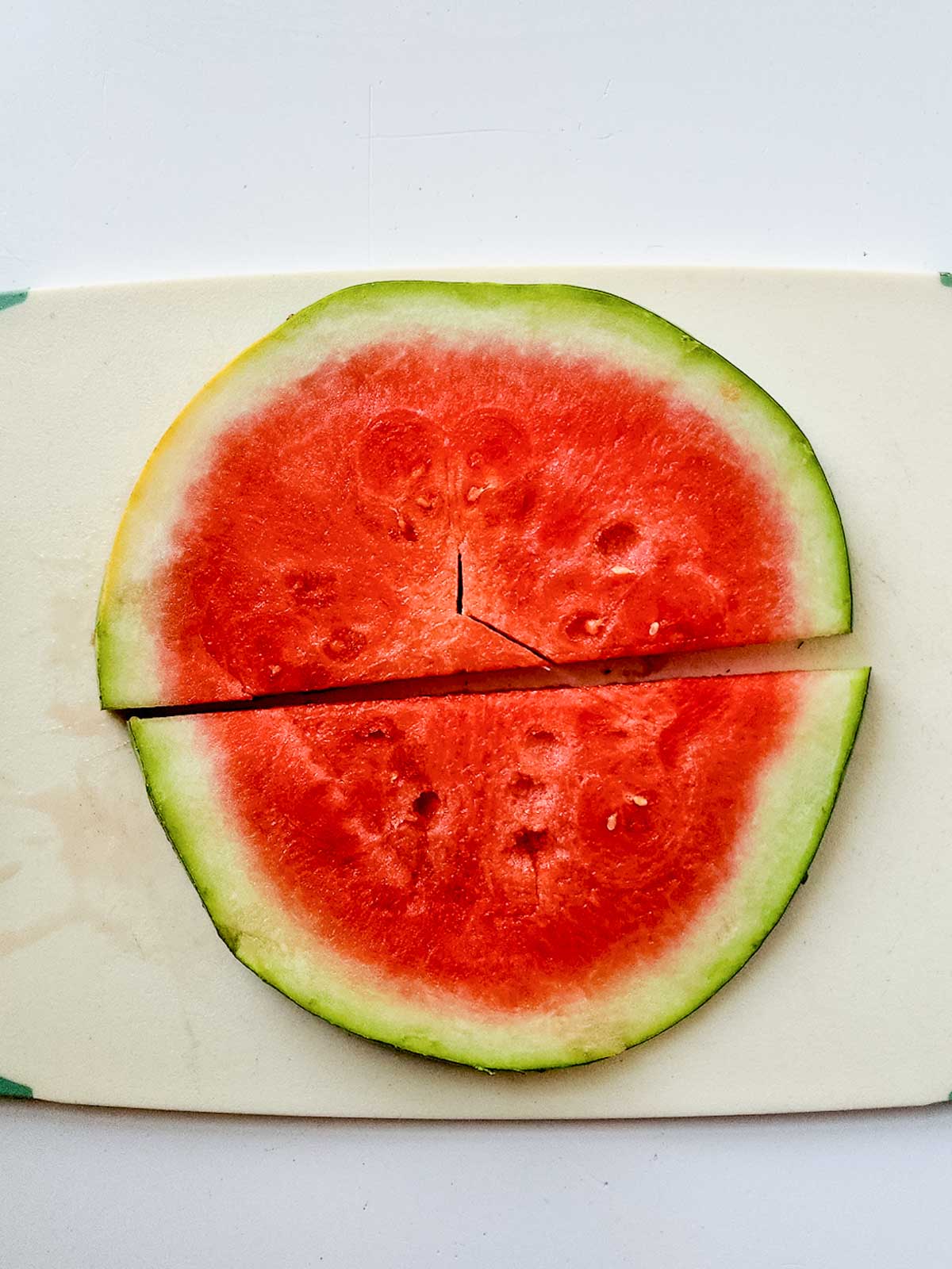 Slice of watermelon on a cutting board