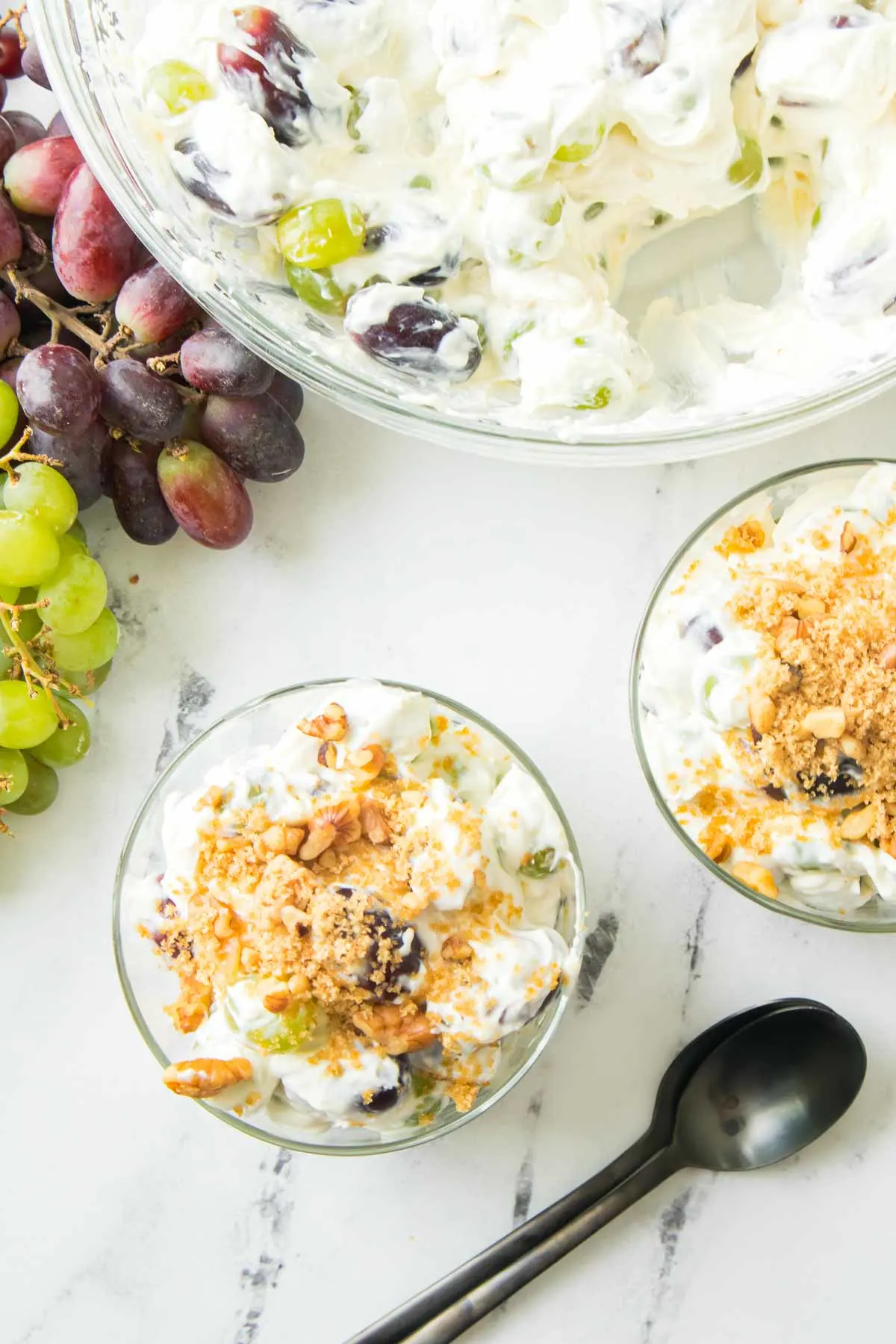 Overhead picture of bowls of grape salad topped with brown sugar