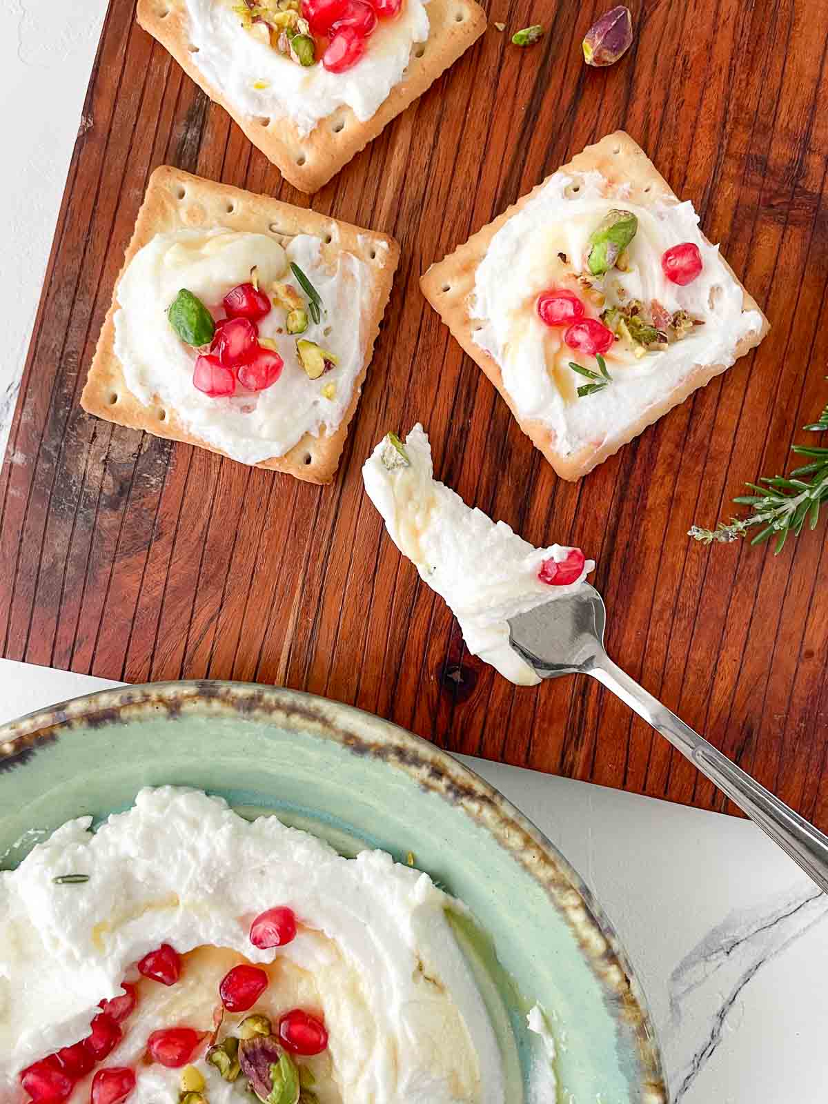 Whipped goat cheese dip spread on crackers
