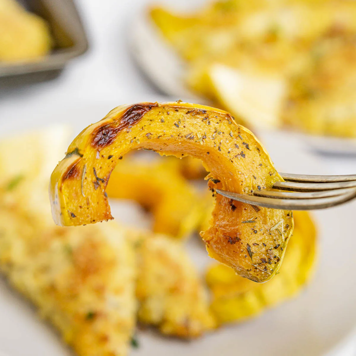 Fork holding air fried delicata squash piece