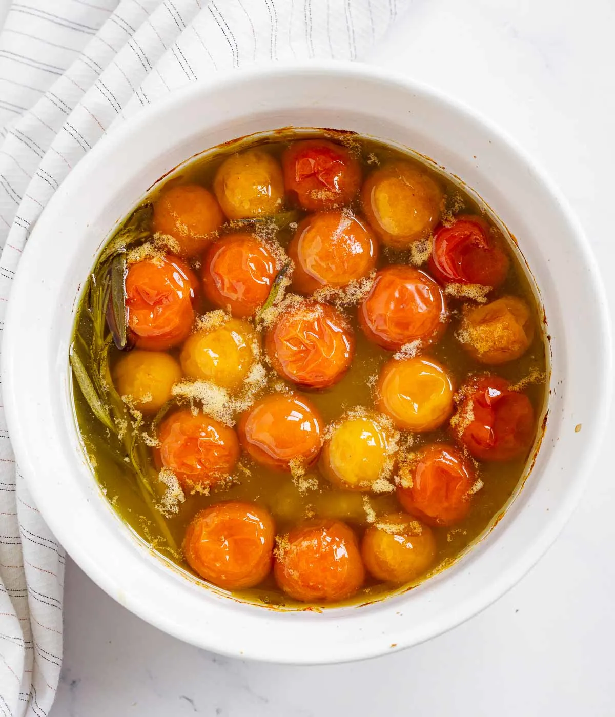 Cooked cherry tomato confit in a baking dish