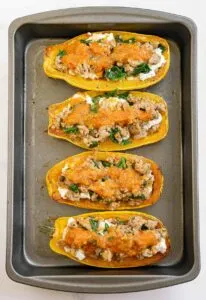 Picture showing how to stuffed delicata squash halves.