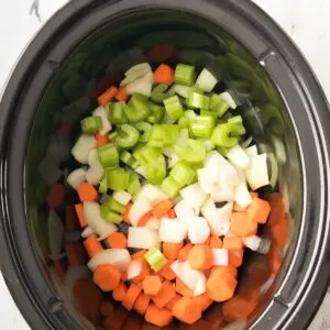 Chopped veggies added to the slow cooker