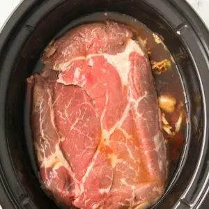 Chuck roast and all ingredients added to the slow cooker