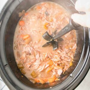 Shredding beef in a slow cooker pot