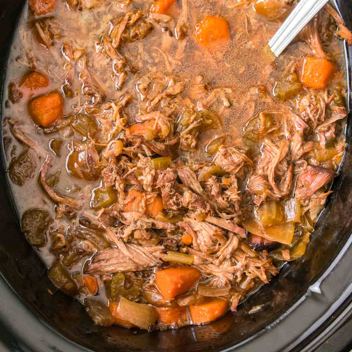 Shredded pot roast in a slow cooker