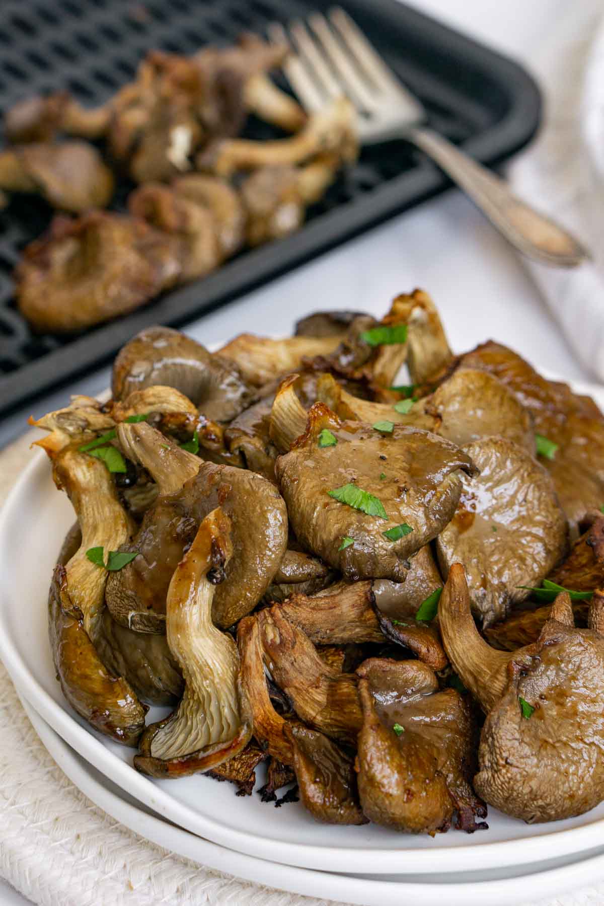 Plate of cooked oyster mushrooms.