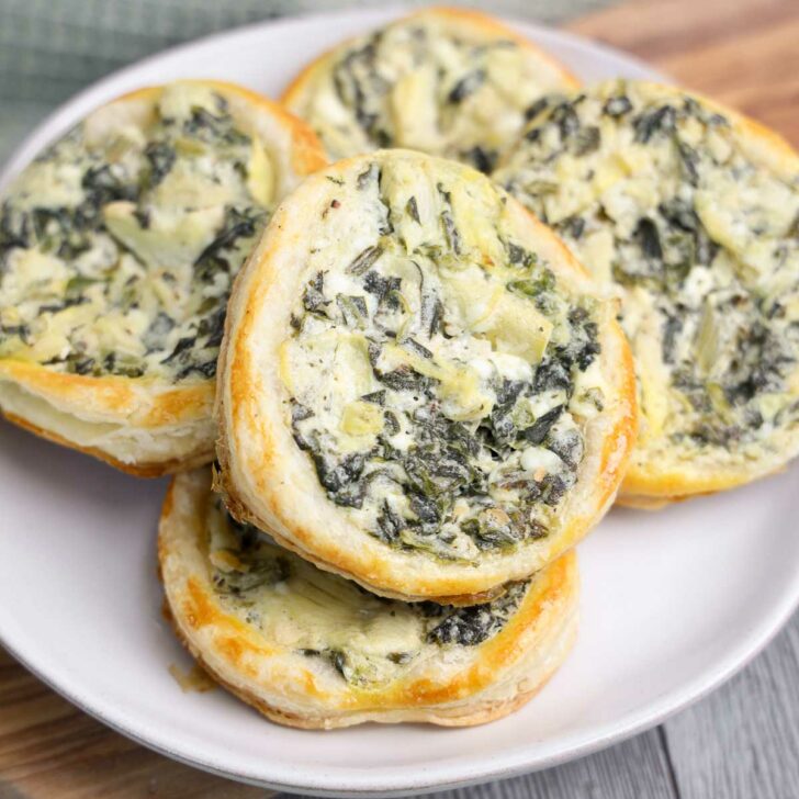 Spinach artichoke puff pastry appetizers on a plate