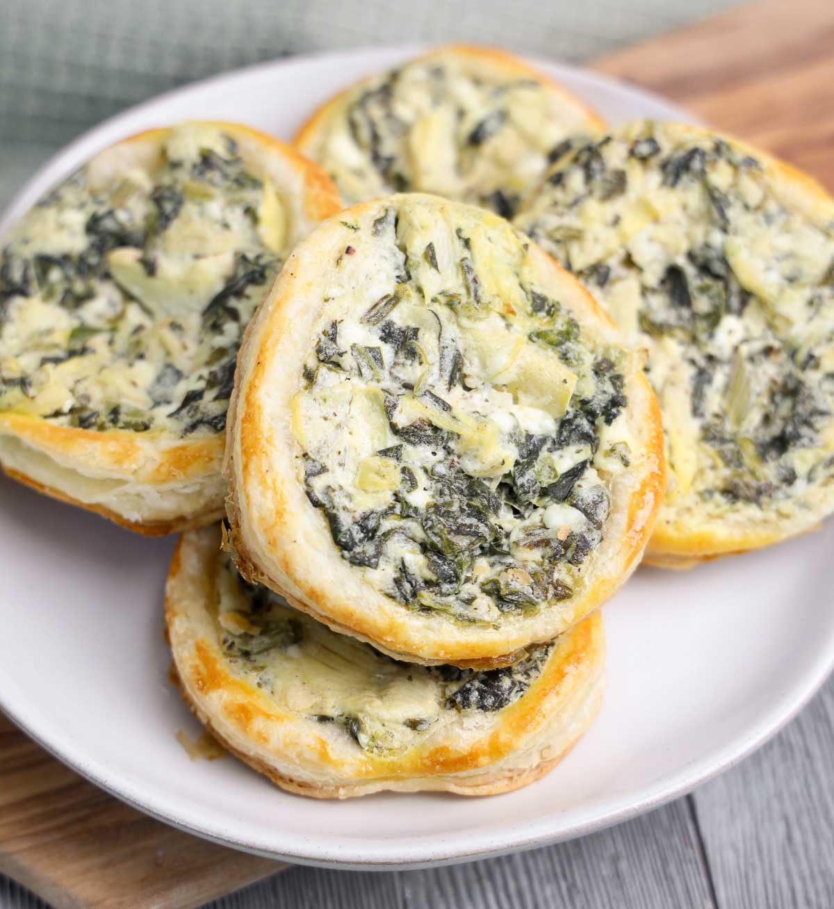 Spinach artichoke puff pastry appetizers on a plate