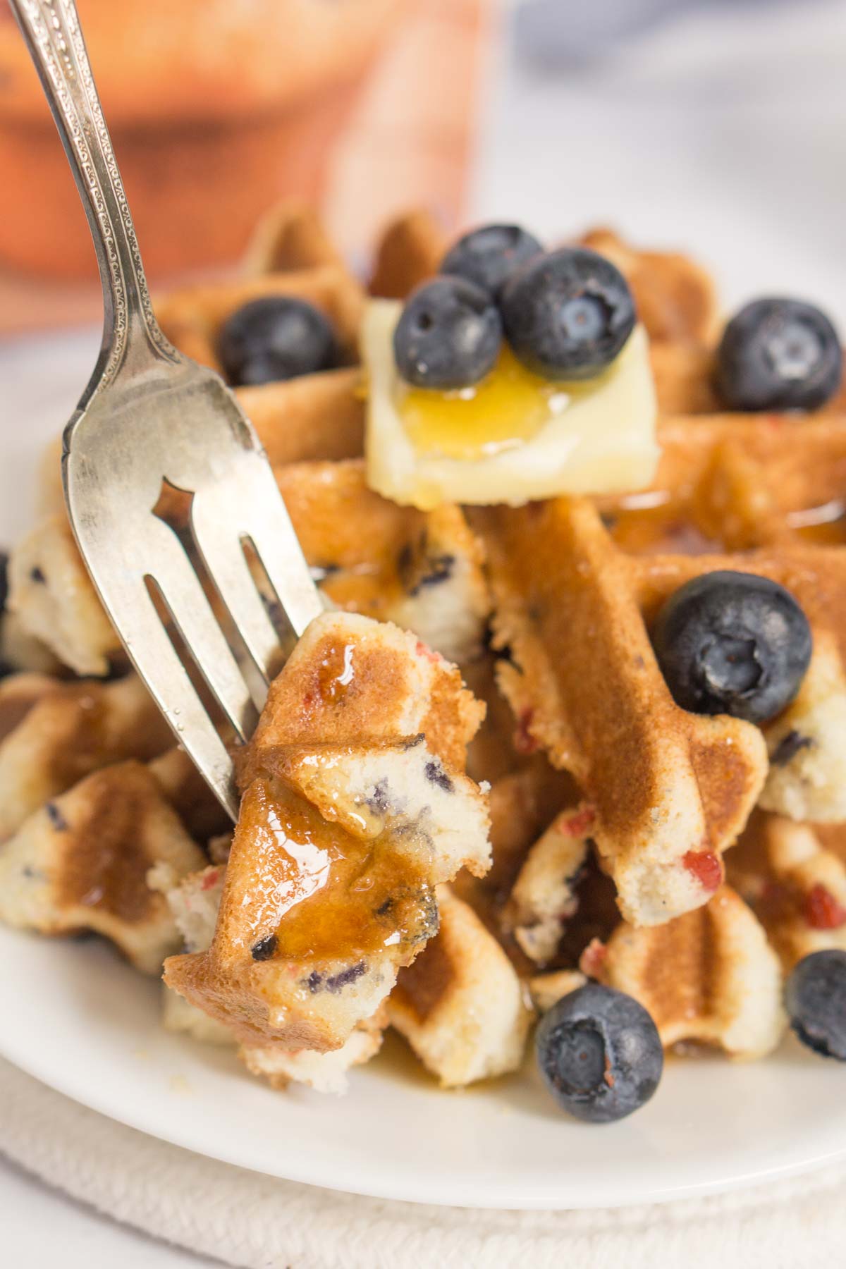 Fork showing the texture of a waffle made from muffin mix.
