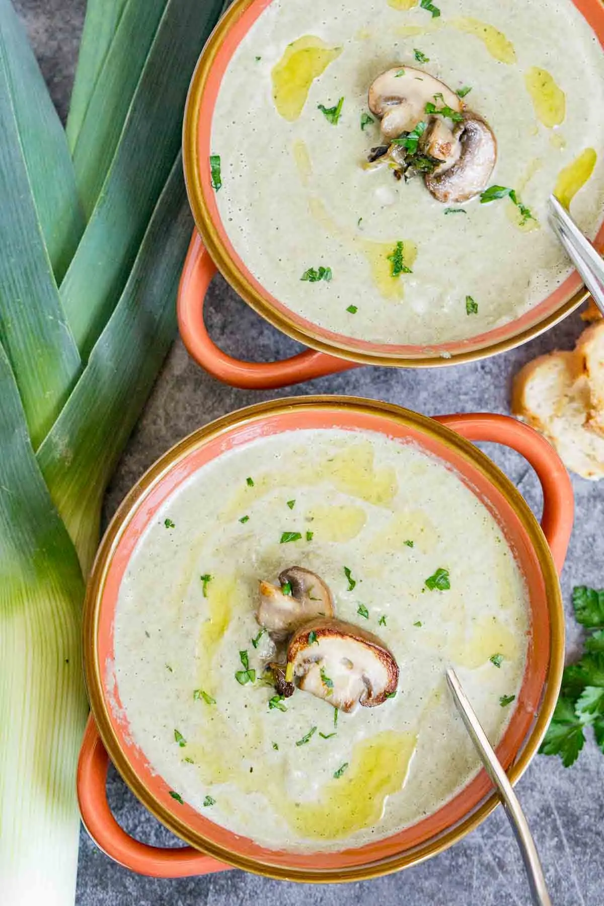 Two bowls of creamy mushroom leek soup