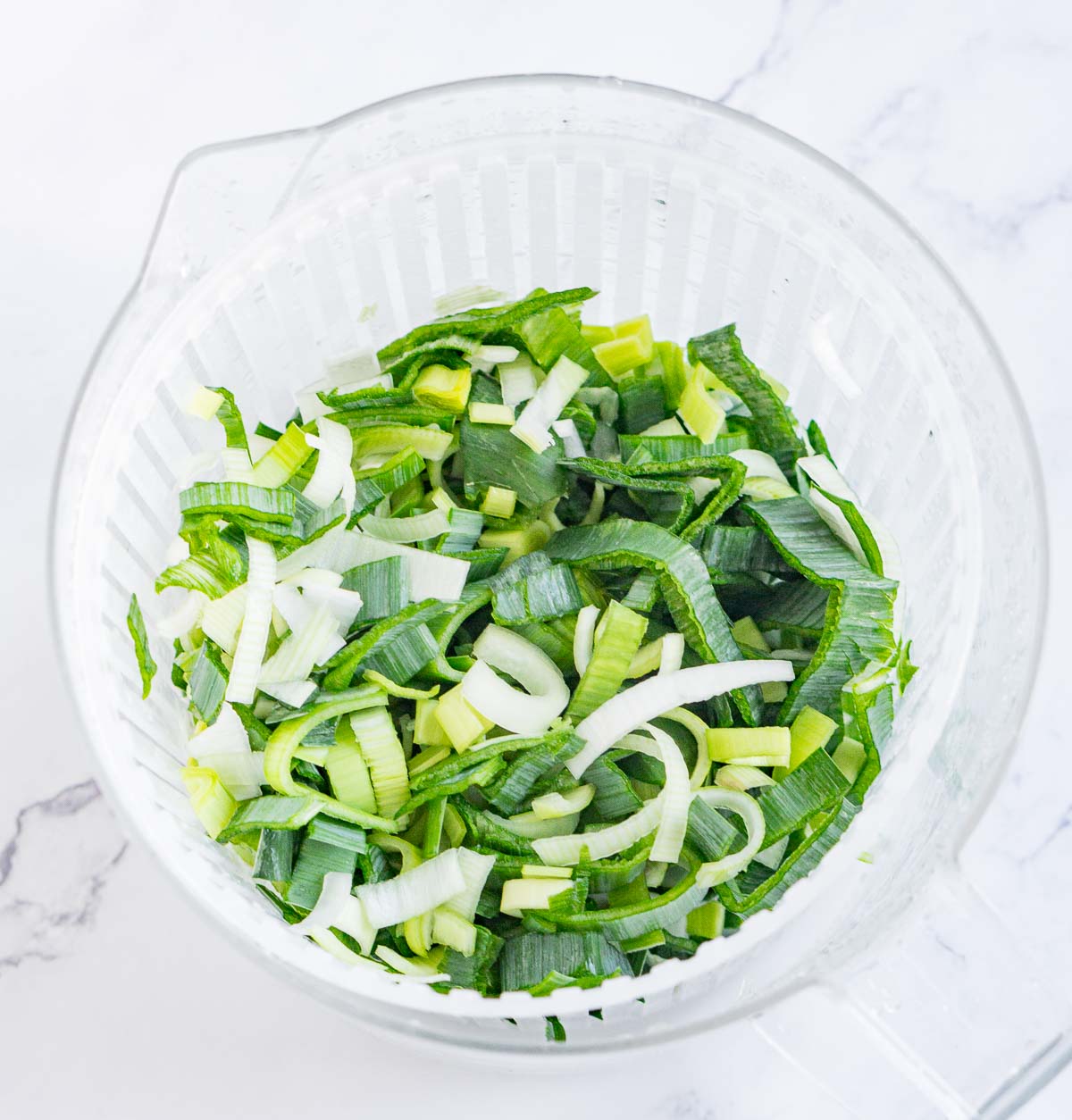Sliced leeks washed and dried in a salad spinner