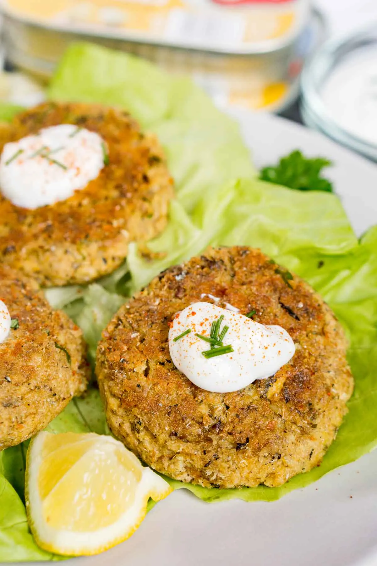 Sardine patties on salad greens