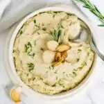 Bowl of garlic and chive butter bean mash