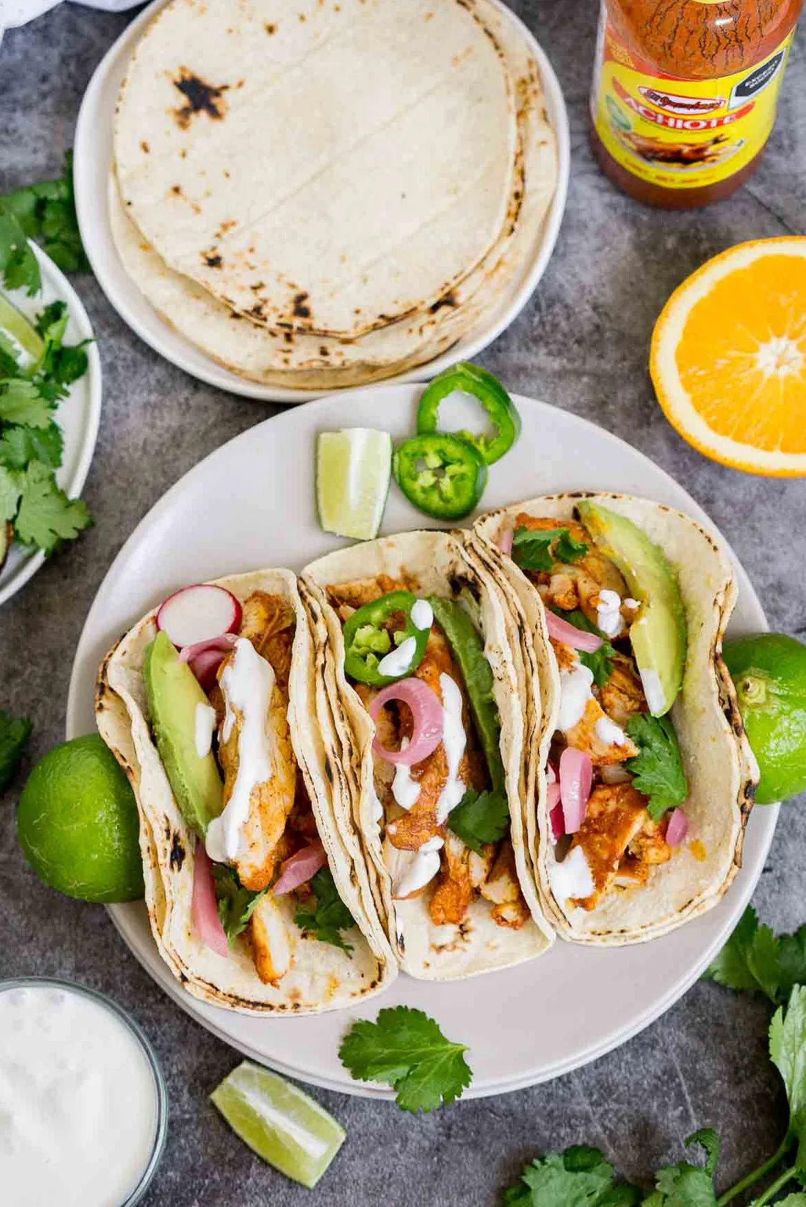 Platter of achiote chicken toppings and toppings