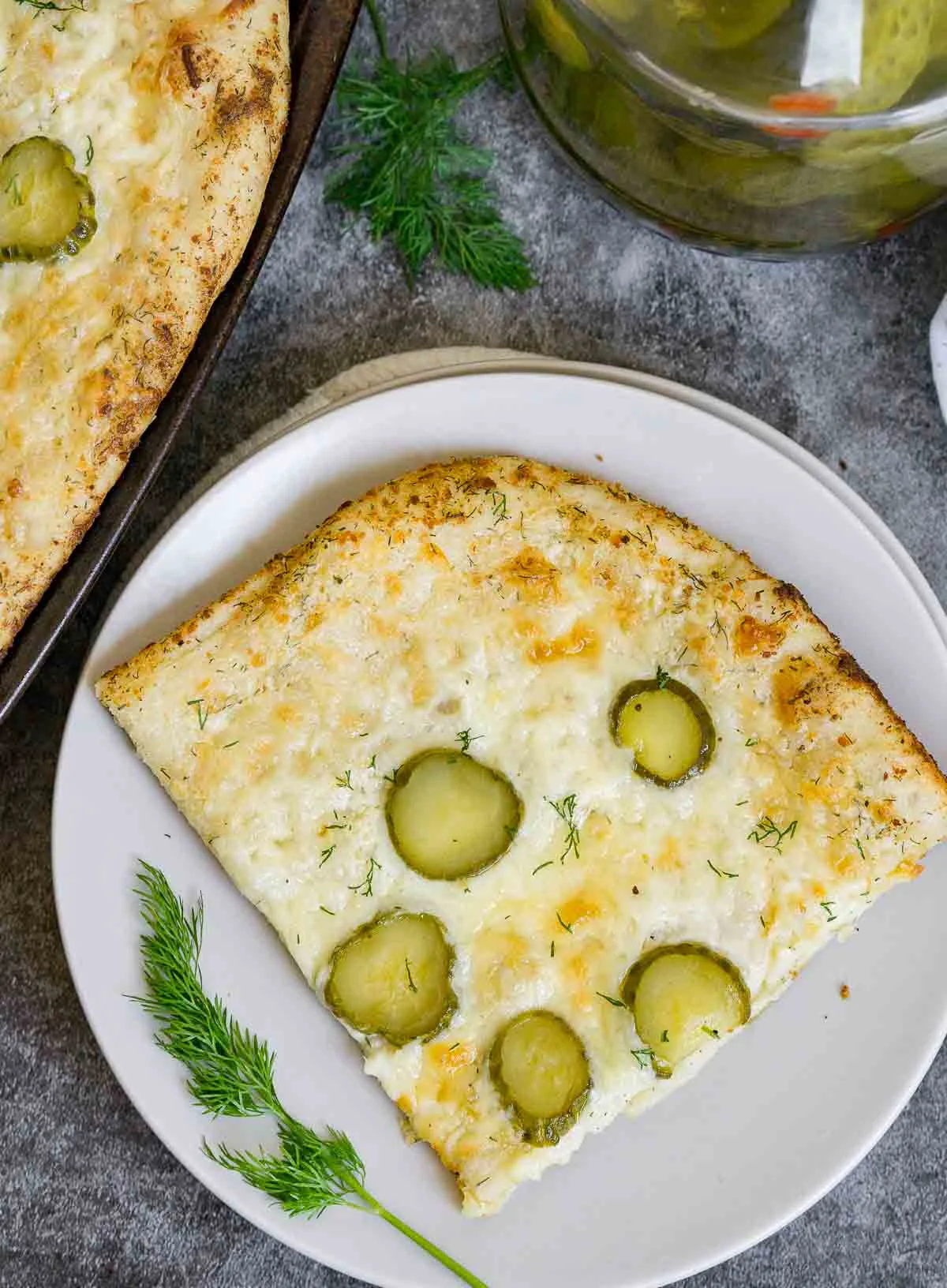 Slice of pickle pizza on a plate