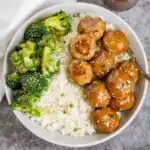 Plate of teriyaki turkey meatballs with rice and broccoli