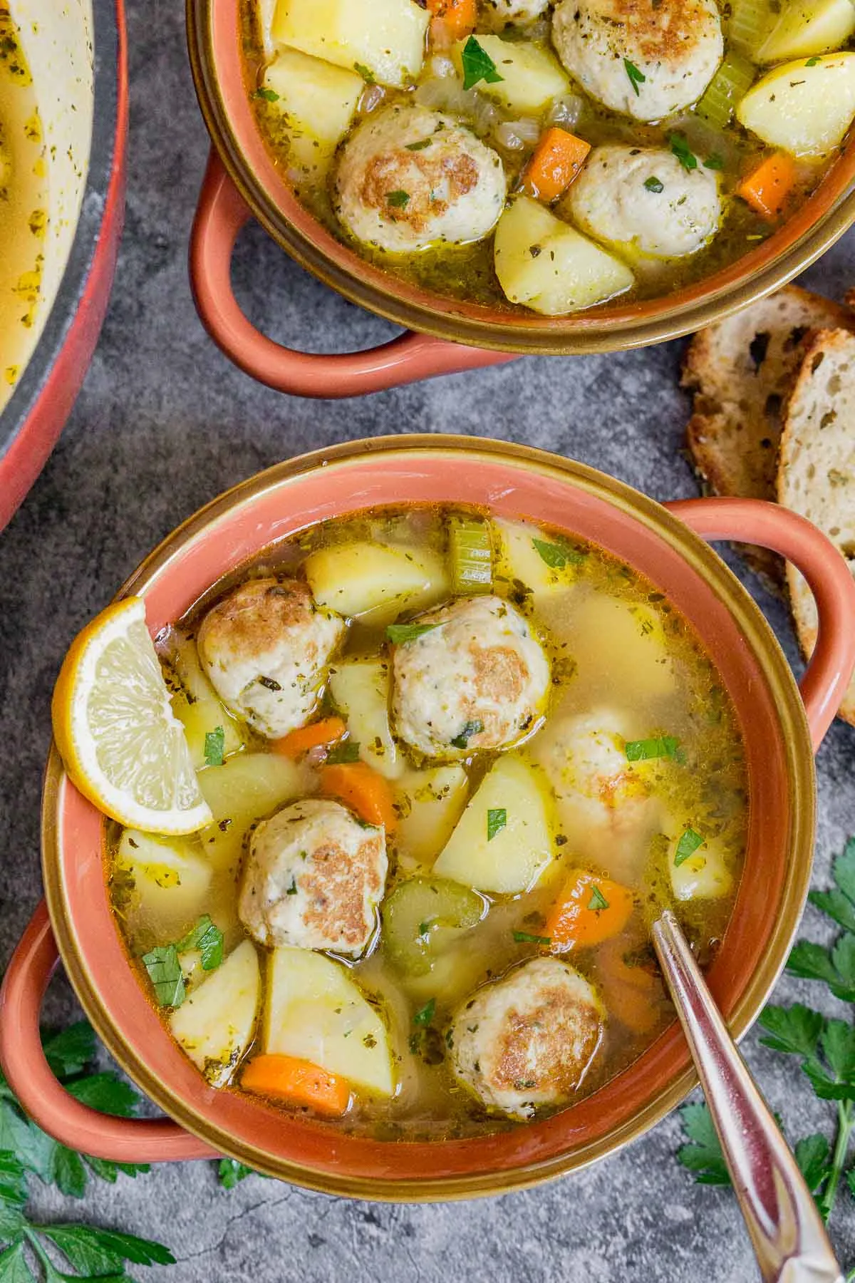 Two bowls of chicken meatball soup