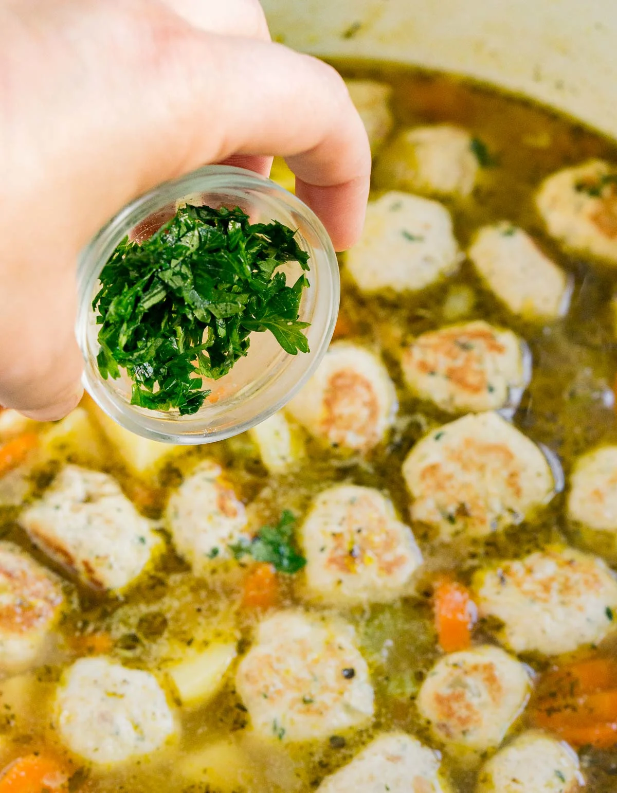 Adding parsley to soup