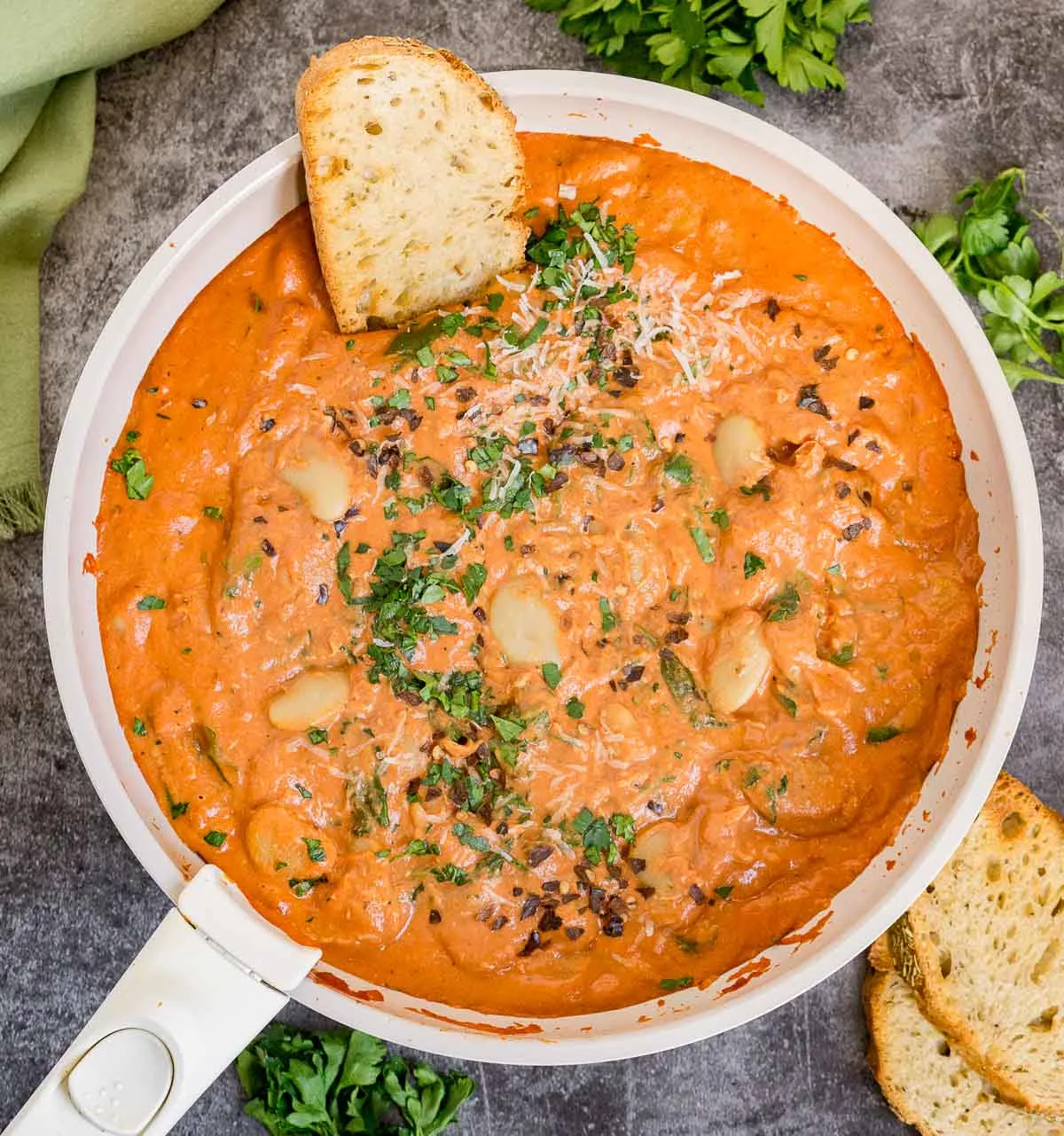 Skillet of butter beans in creamy tomato sauce